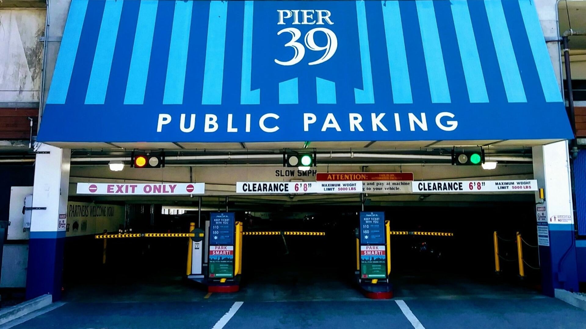 signage for a parking garage with barriers